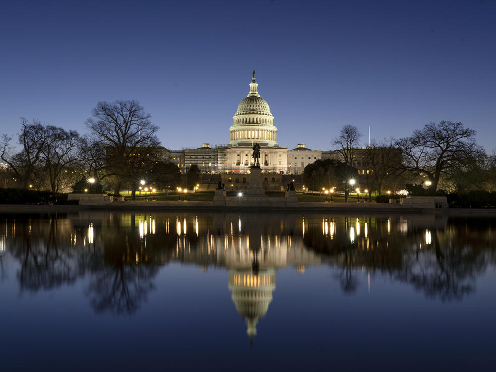 The U.S. Capitol building is seen before sunrise on Capitol Hill in Washington.
