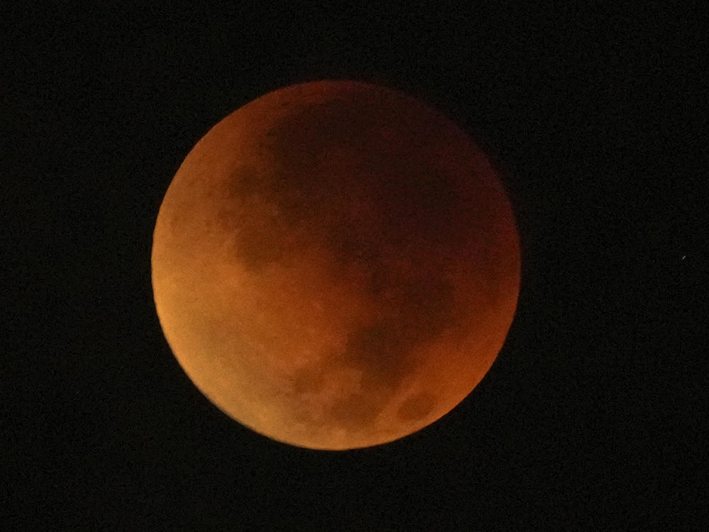 A total lunar eclipse graces the night skies during the first blood moon of the year, in Brasilia, Brazil, Sunday, May 15.