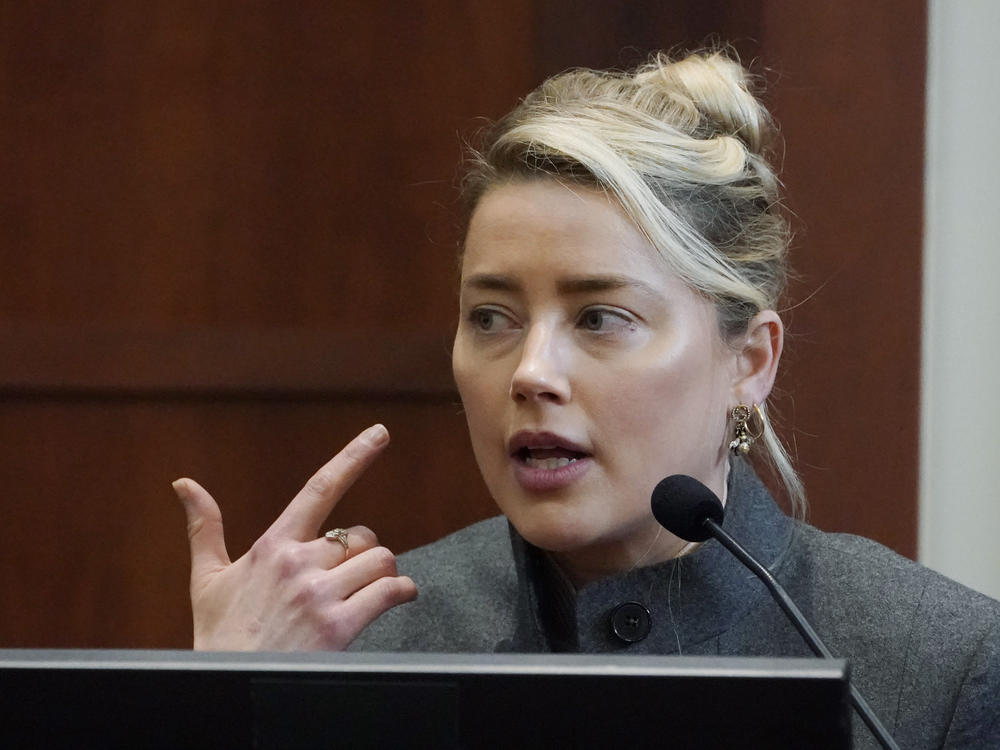 Actor Amber Heard testifies in the courtroom at the Fairfax County Circuit Courthouse in Fairfax, Va., on Monday. Actor Johnny Depp sued his ex-wife for libel in Fairfax County Circuit Court after she wrote an op-ed piece in <em>The Washington Post</em> in 2018 referring to herself as a 
