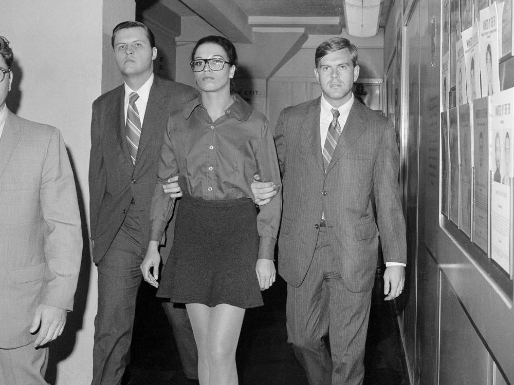 Angela Davis is escorted by two FBI agents after her arrest in New York on Oct. 13, 1970. She was taken from FBI headquarters to the Women's House of Detention.