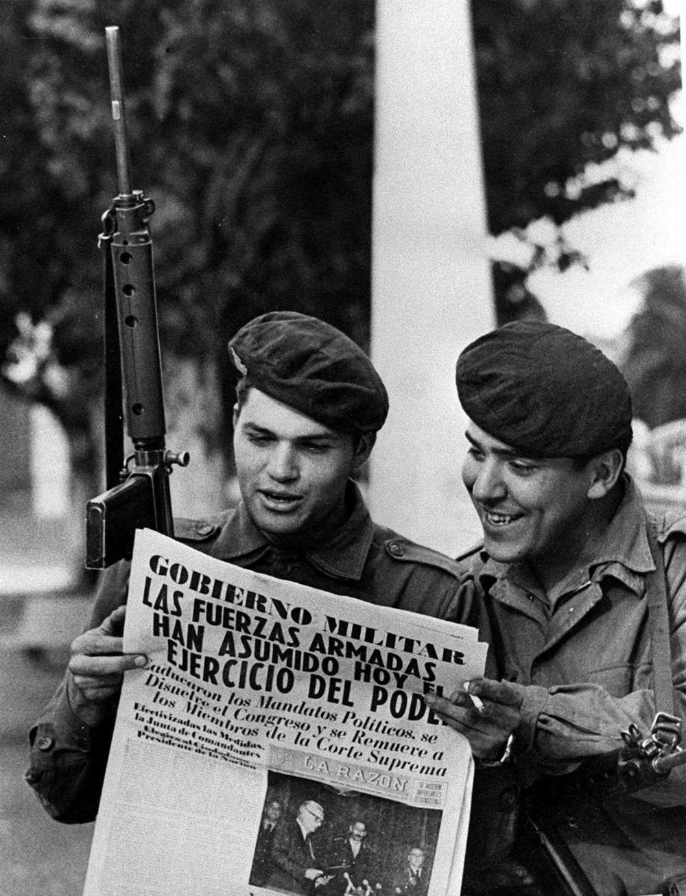 In March 1976, two soldiers read a newspaper in the Buenos Aires Plaza de Mayo after a military coup led by Gen. Jorge Rafael Videla ousted President Isabel Peron. The newspaper headline reads in Spanish; 