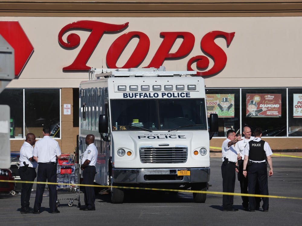 Police and FBI agents continue their investigation of the shooting at Tops market on Sunday in Buffalo, N.Y. A gunman opened fire at the store killing ten people and wounding another three on Saturday.