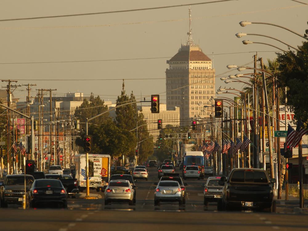 Traffic on a hazy evening in Fresno, Calif. A new study estimates that about 50,000 lives could be saved each year if the U.S. eliminated small particles of pollution that are released from the tailpipes of cars and trucks, among other sources.