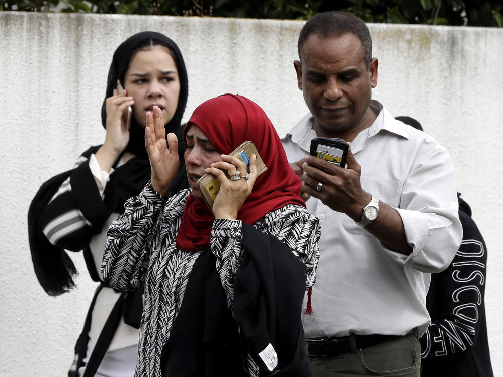 People wait outside the Al Noor mosque following a mass shooting March 15, 2019, in central Christchurch, New Zealand.