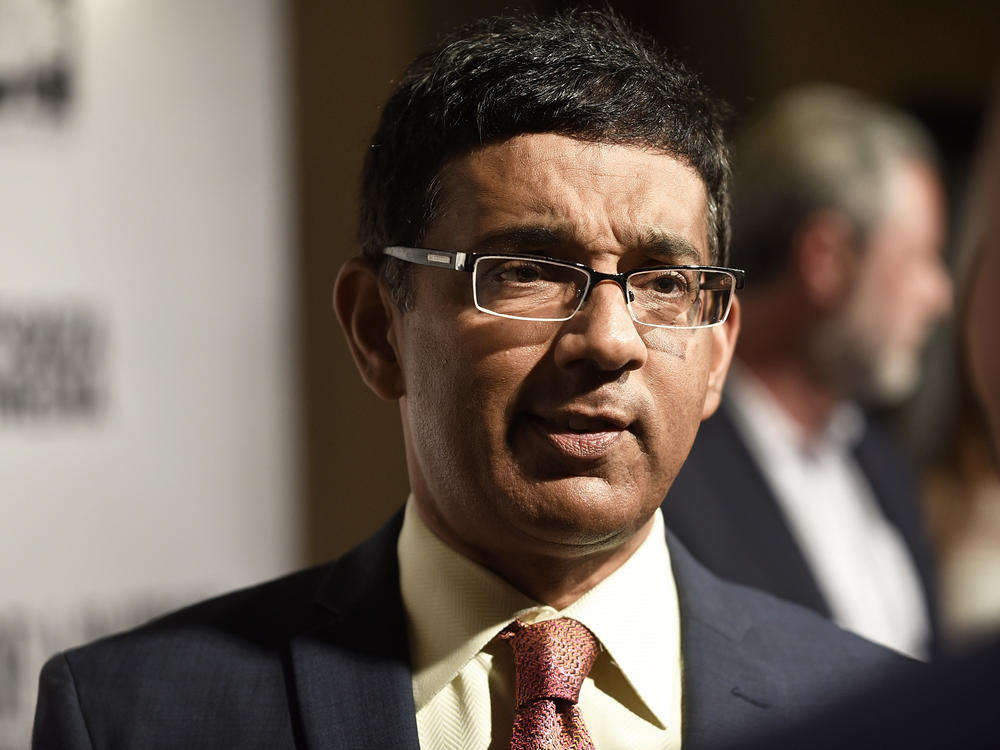 Dinesh D'Souza, seen here at a premiere of one of his films in 2018, has released a new film alleging voter fraud in the 2020 presidential election. Fact checkers have cast doubt on many of the film's claims.