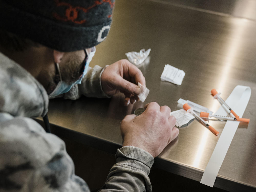 A man uses a safe injection site in New York City in January. A bill in California would allow pilot sites in San Francisco, Oakland and Los Angeles.