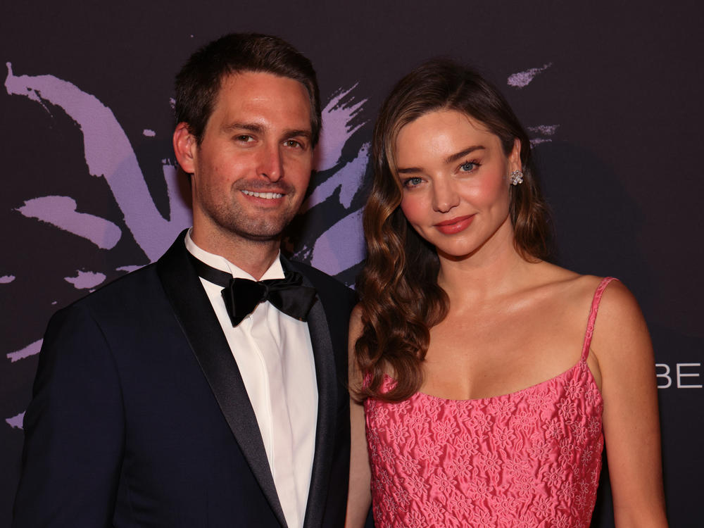 Snap CEO Evan Spiegel and KORA Organics CEO Miranda Kerr attend a gala in Beverly Hills, Calif., on May 4. The couple surprised graduates of a Los Angeles art school by paying off their student debt.