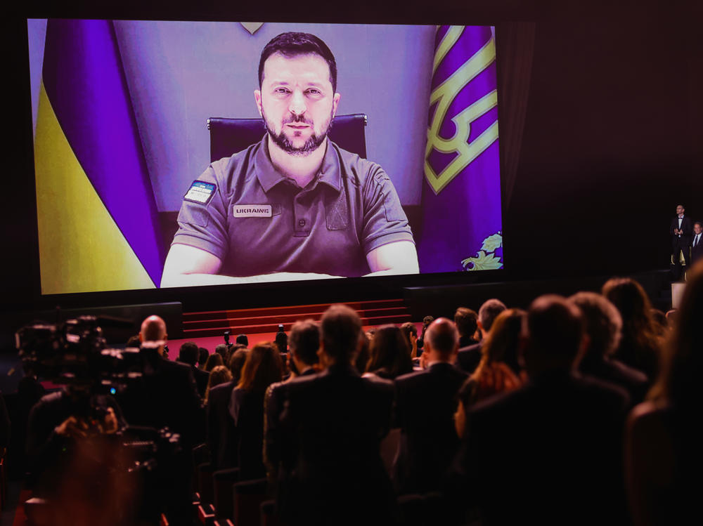 Ukraine's President Volodymyr Zelenskyy speaks via video during the opening ceremony for the 75th Cannes Film Festival in Cannes, France, on Tuesday.