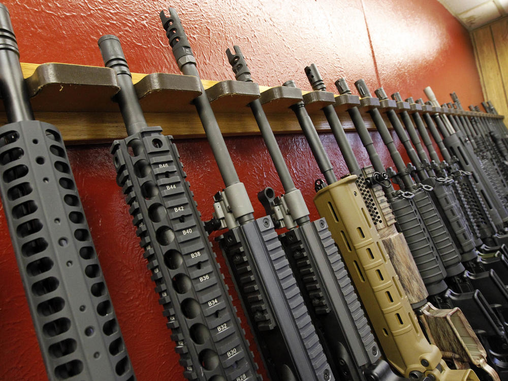 A row of rifles for sale is on display at a gun shop in Aurora, Colo., on July 20, 2012. The mass shooting in Buffalo, N.Y., has prompted questions about the effectiveness of 