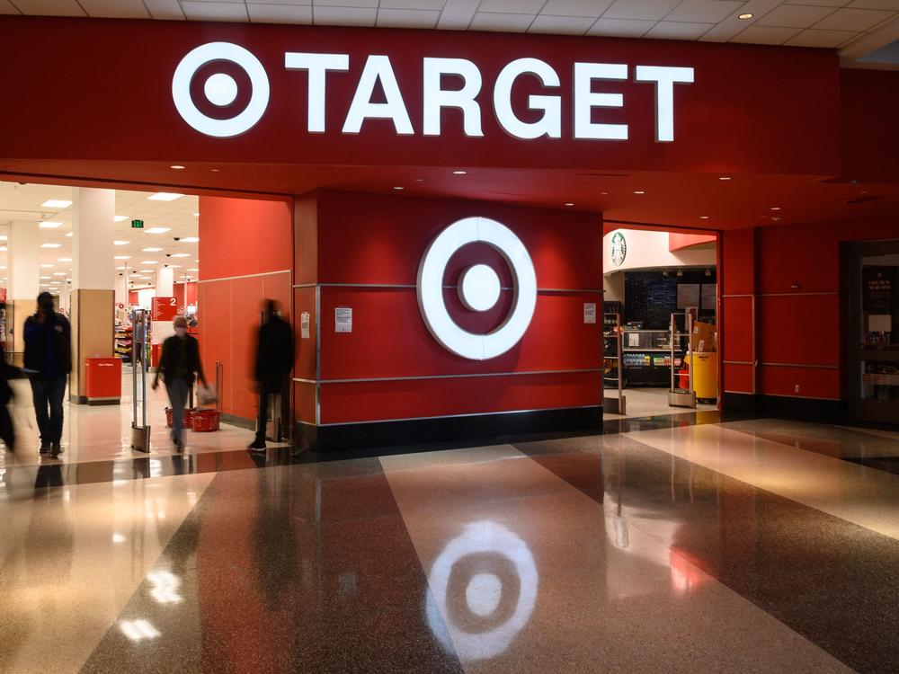 Shoppers enter a Target store in Washington, D.C., on Feb. 17. Target said earnings fell in the first three months of the year as rising costs are eating into profits, among other factors.