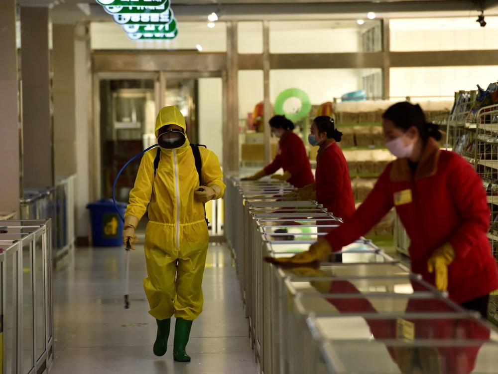 Employees spray disinfectant and wipe surfaces as part of preventative measures against the coronavirus at the Pyongyang Children's Department Store in March.