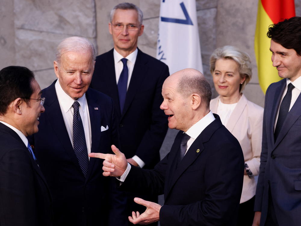 From left, Japan's Prime Minister Fumio Kishida, U.S. President Joe Biden and Germany's Chancellor Olaf Scholz speak as NATO Secretary General Jens Stoltenberg, back, European Commission President Ursula von der Leyen, and Canada's Prime Minister Justin Trudeau listen during a NATO summit on Russia's invasion of Ukraine in Brussels on March 24, 2022.