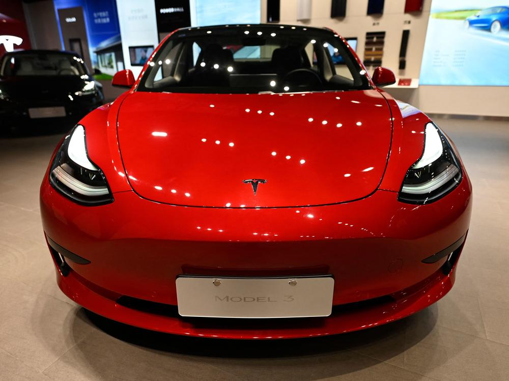 A Tesla Model 3 car is seen at a Tesla showroom at a shopping mall in Beijing, China, on April 29. Wood bet big on Tesla back when Wall Street was more cautious about the electric car manufacturer.