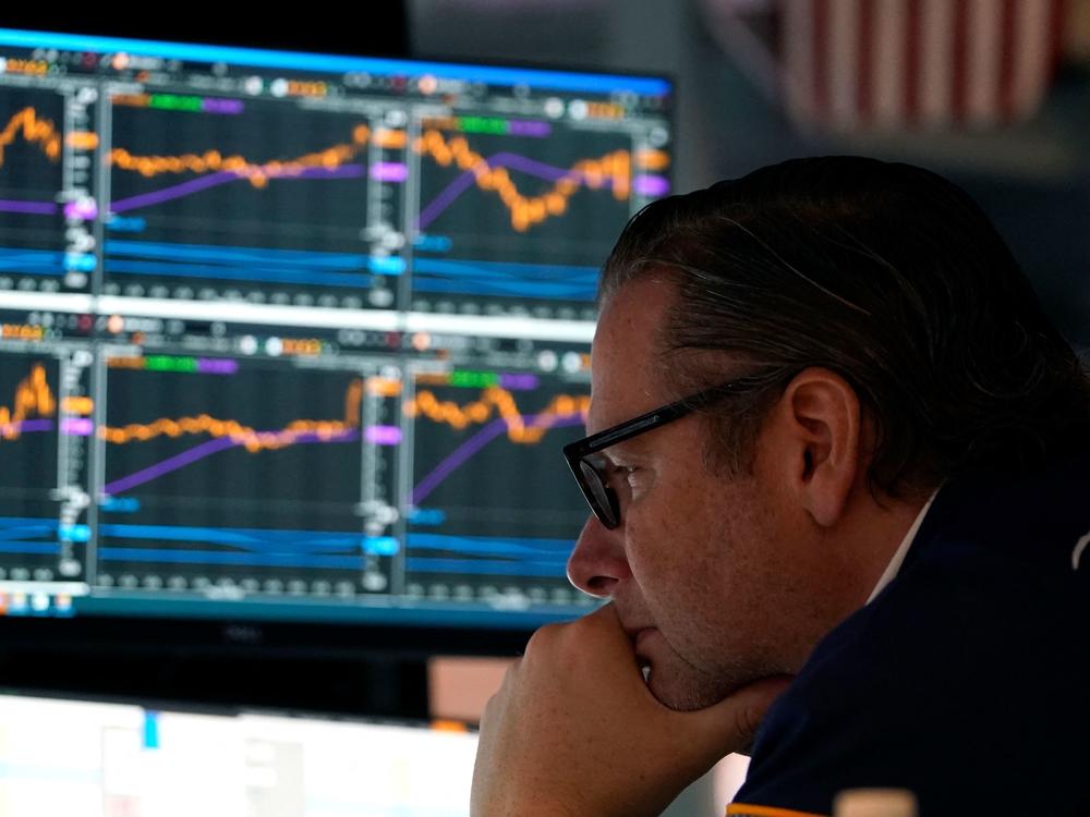 Traders work on the floor during the opening bell of the New York Stock Exchange in New York City on May 16. Stocks slumped on Wednesday as earnings from major retailers such as Target reinforced concerns about the U.S. economy.