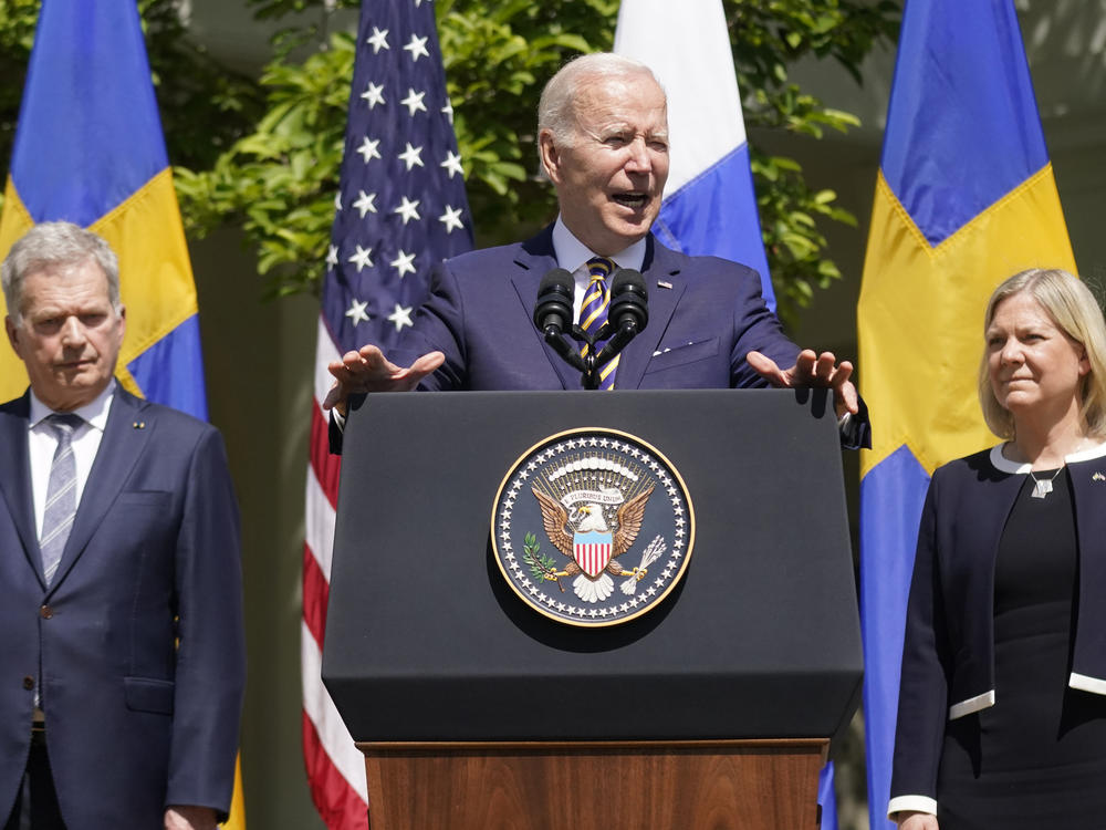 President Joe Biden, standing with Swedish Prime Minister Magdalena Andersson and Finnish President Sauli Niinisto, speaks in the Rose Garden of the White House on Thursday.