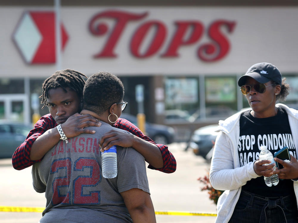 People gathered outside of Tops market embrace on Sunday.