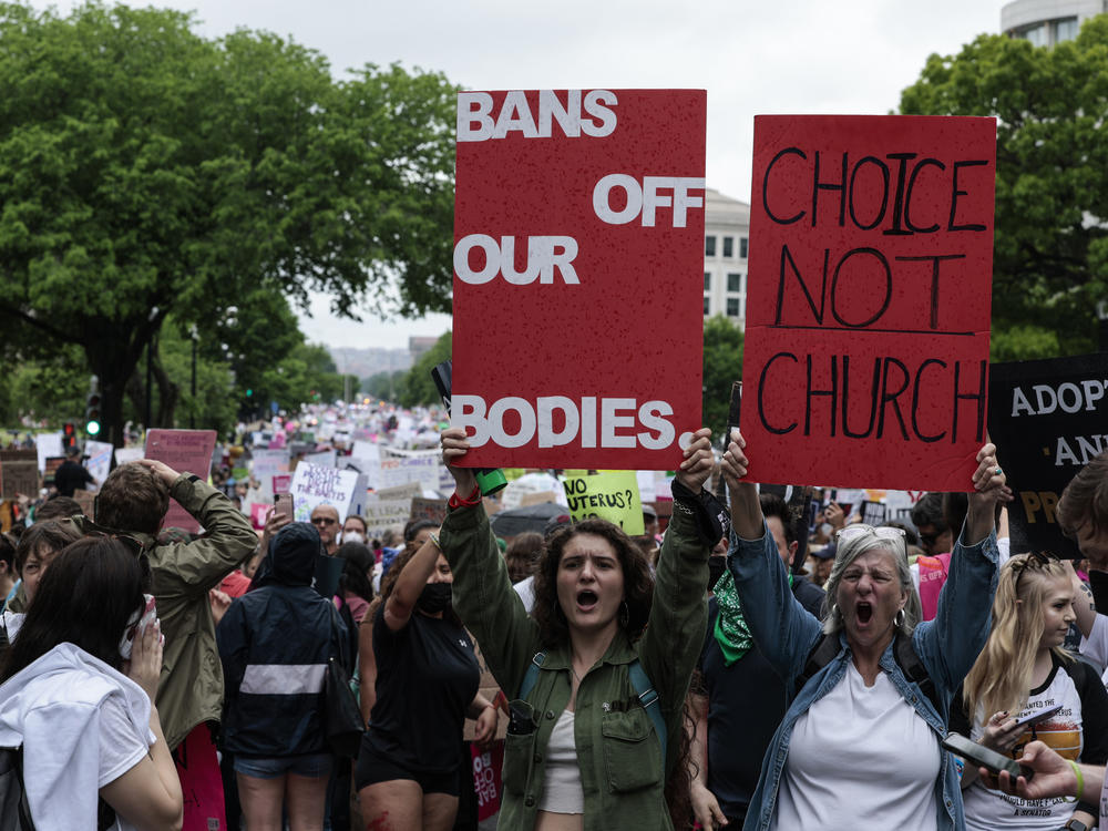 Abortion-rights demonstrators yell as they walk down Constitution Avenue during the Bans Off Our Bodies March on Saturday in Washington, D.C.