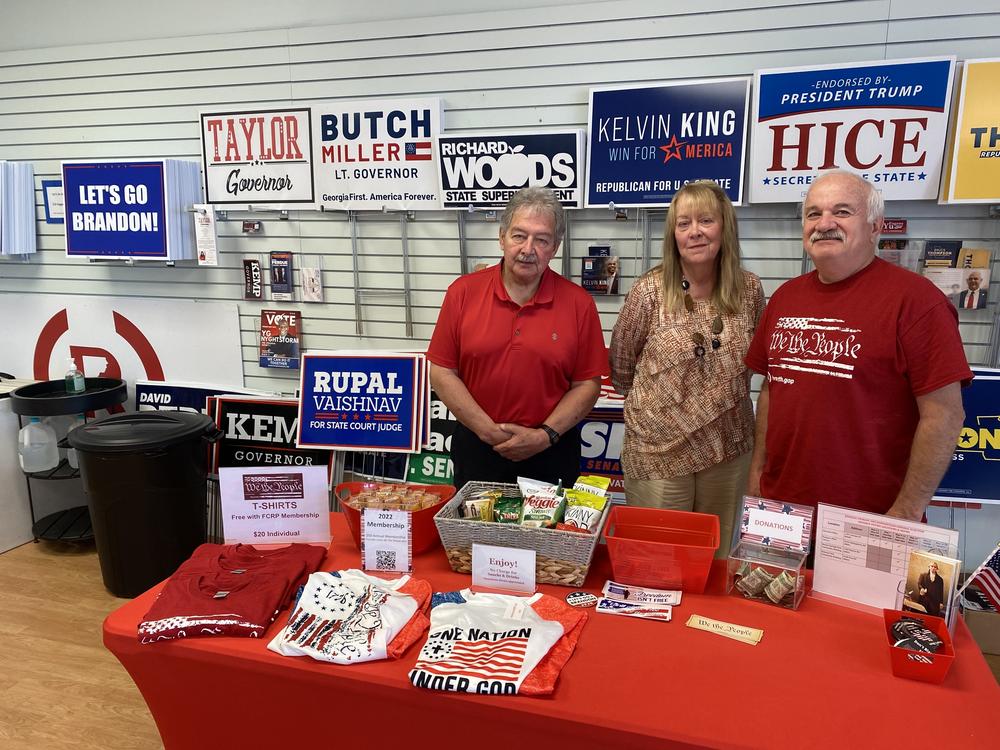 Joe Marinich (right), the Republican chairman of Forsyth County, Ga., poses at the party headquarters with Bea Wilson and Ed Murray, two recently trained poll watchers.