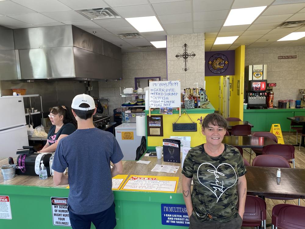 Vicky Lou Kerner is the owner of Vicky Lou's Burgers in Forsyth County, Ga. The signs posted on her counter include one that reads, 