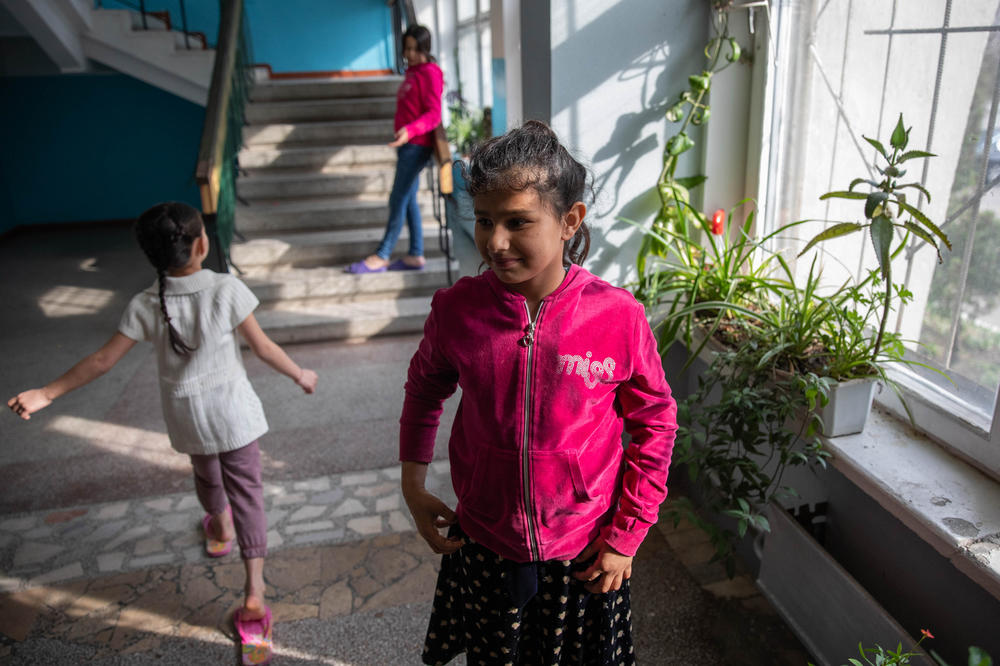 Girls stand in the hallway of a temporary housing center for refugees in Chisinau, Moldova, in April. The center is mostly hosting people from the Roma community and other minority groups from Ukraine.
