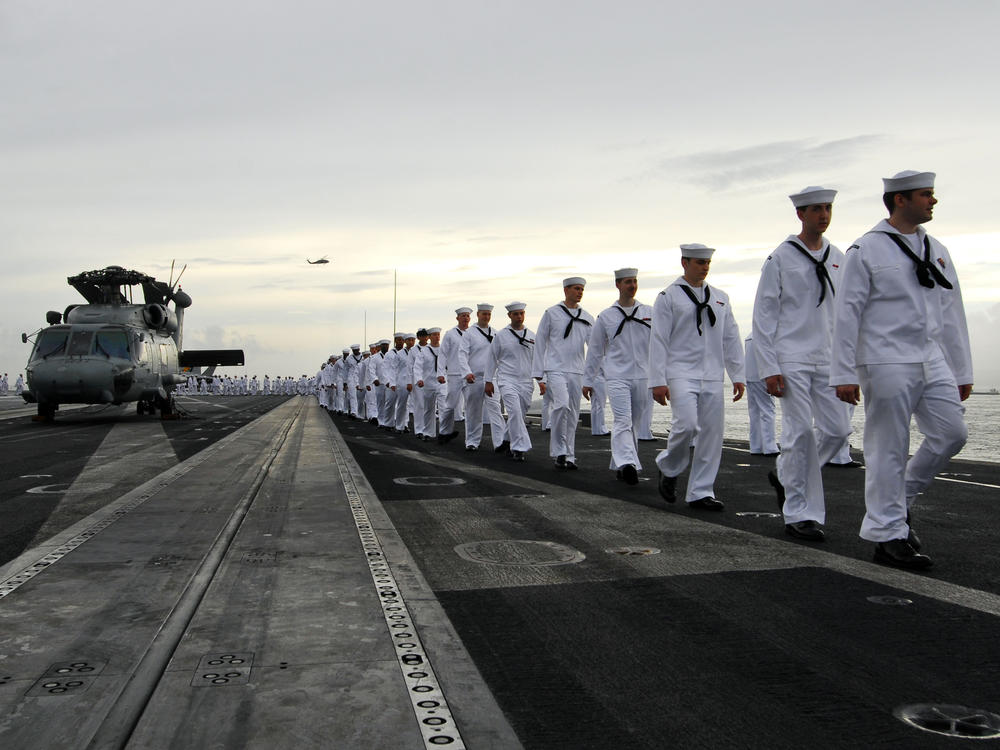 Sailors are seen aboard the USS George Washington in Yokosuka, Japan, in 2011. The U.S. Navy has seen a spike in desertions, with numbers more than doubling from 2019 to 2021. <em></em>