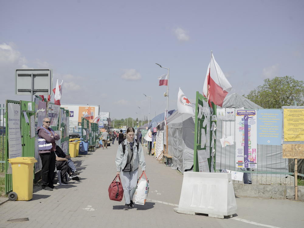 People leave the aid camp at the Poland-Ukraine border in Medyka, Poland.