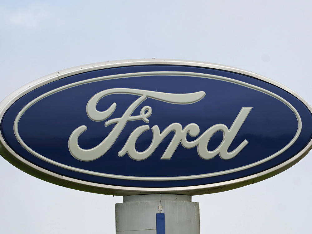 A Ford logo is seen on a sign at Country Ford in Graham, N.C. The auto manufacturer has issued a recall that affects about 39,000 SUVs.