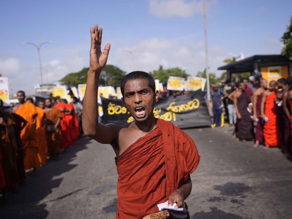 A student monk representing Inter University Students Federation shouts slogans during an anti government protest in Colombo, Sri Lanka, Thursday, May 19, 2022. Sri Lankans have been protesting for more than a month demanding the resignation of President Gotabaya Rajapaksa, holding him responsible for the country's worst economic crisis in recent memory.
