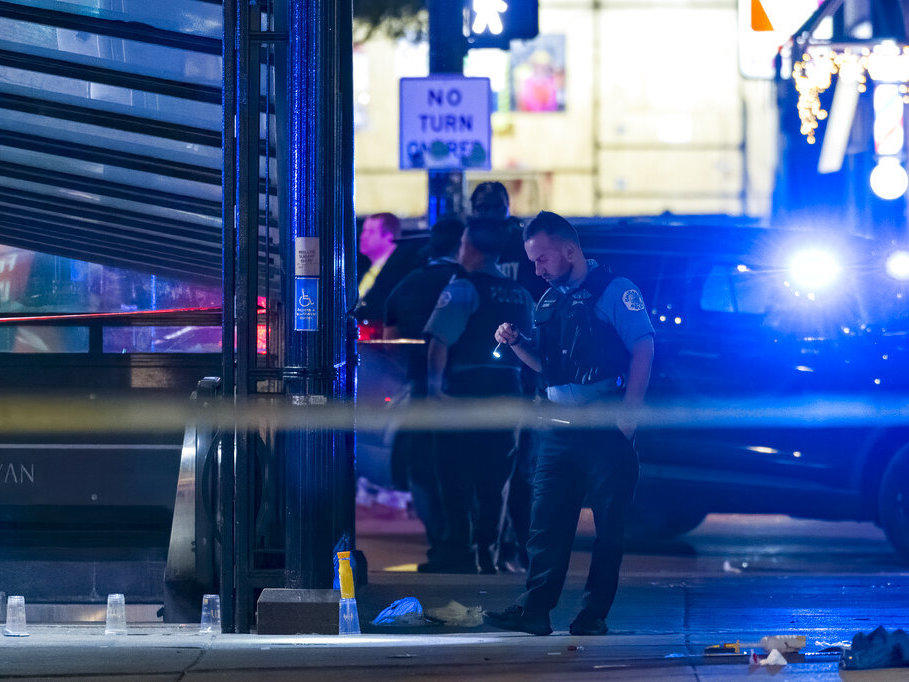 Chicago police work at the scene of a shooting Thursday near East Chicago Avenue and North State Street in the Near North Side neighborhood.
