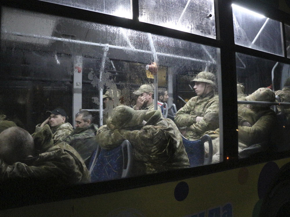 Ukrainian servicemen from the Azovstal steel plant sit on a bus near a penal colony, in Olyonivka, in territory under the government of the Donetsk People's Republic, on Friday.