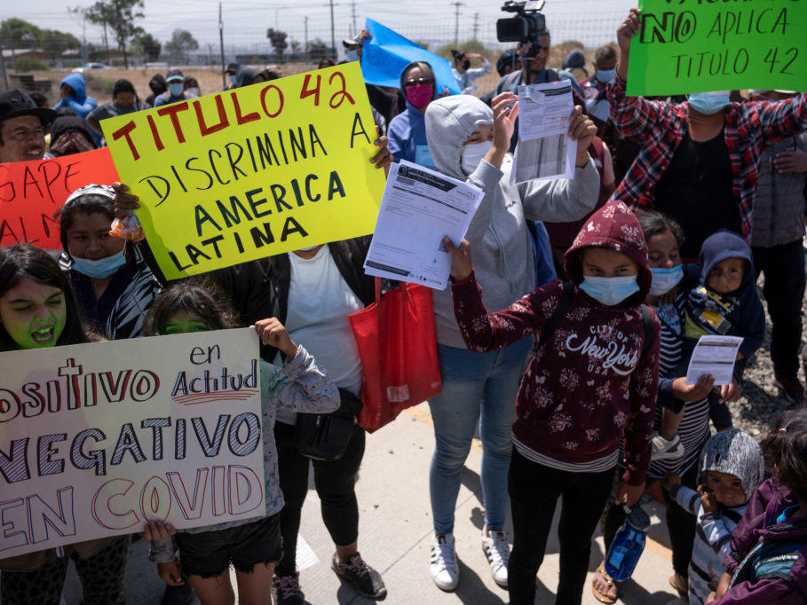 Migrants and asylum seekers protest outside the United States Consulate against the public health order known as Title 42, in Tijuana, Mexico, on May 19.