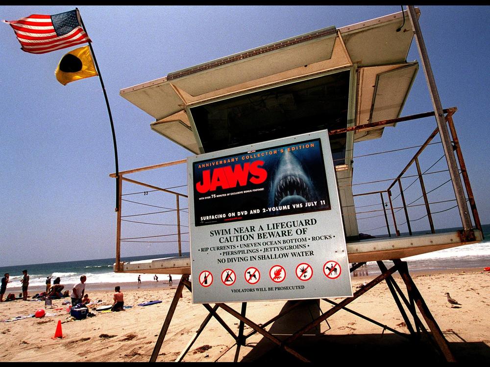 A poster advertising the anniversary collector's edition of the movie <em>Jaws</em> is posted on a lifeguard tower in 2000 on Zuma Beach in Malibu, Calif.