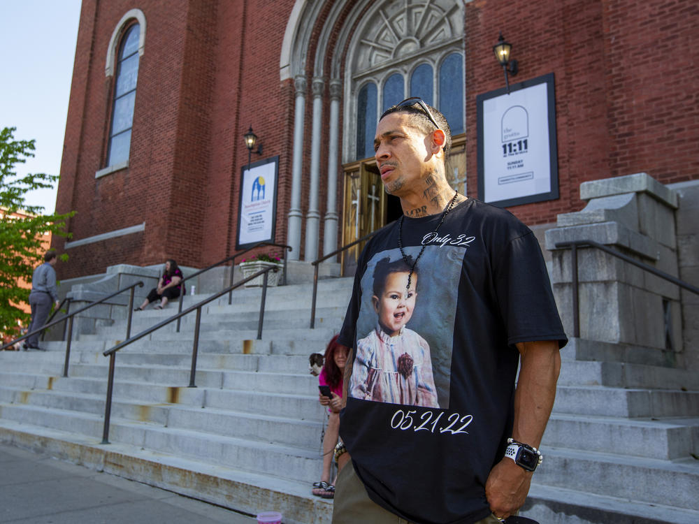 Enrique Owens, a cousin of Roberta Drury, wears a T-shirt with her photograph on it before her funeral service on Saturday in Syracuse, N.Y. Drury was one of 10 killed during a mass shooting at a supermarket last week in Buffalo.