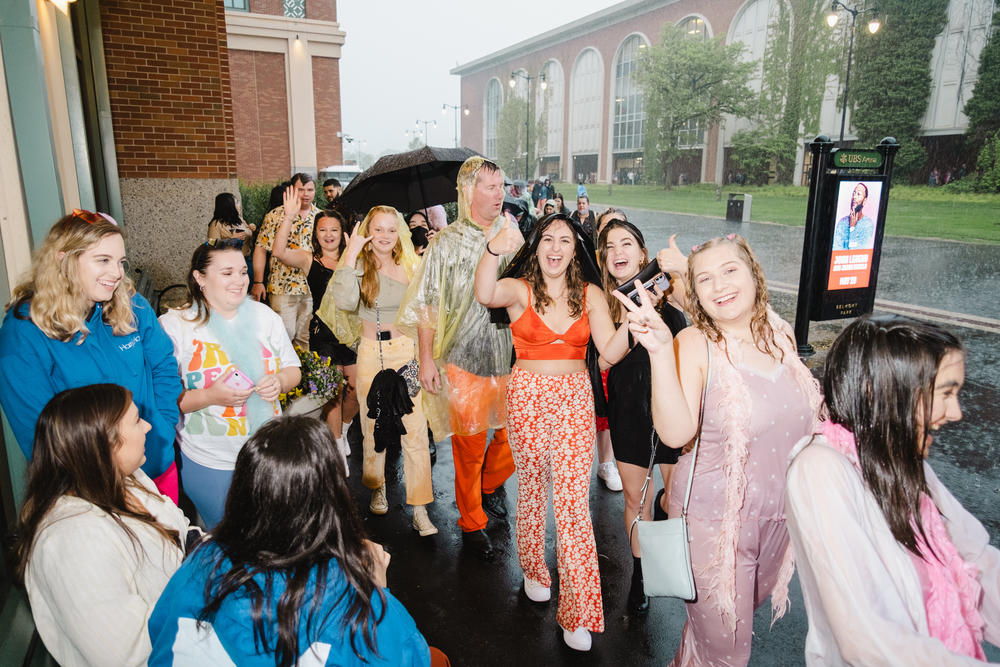 Despite the rain, fans remained in good spirits as they gathered from around the world to see Harry Styles.