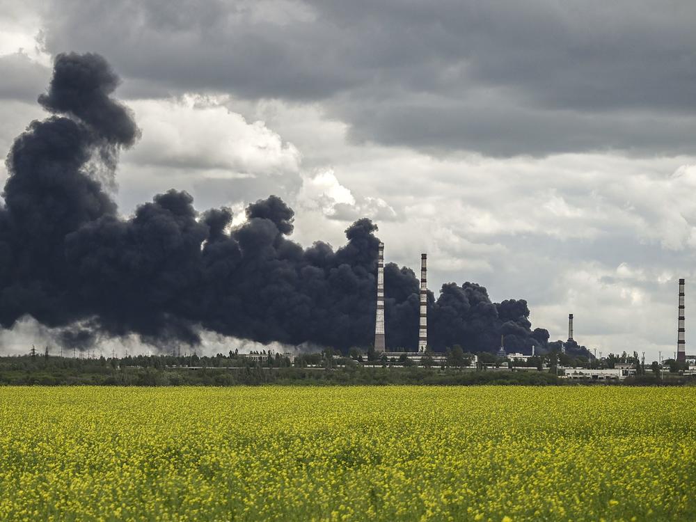 Smoke rises after an attack on an oil refinery in the Donbas region of eastern Ukraine on Sunday.