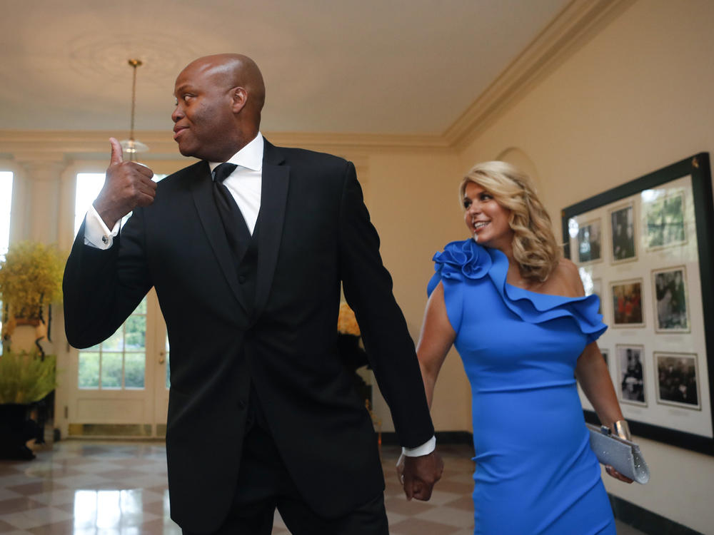 The University School of Milwaukee says it has filed a motion in court to dismiss a lawsuit filed by Craig and Kelly Robinson, the brother and sister-in-law of former first lady Michelle Obama. Here, they arrive at a state dinner at the White House in 2016.