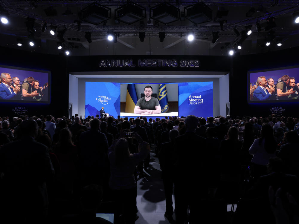 Ukrainian President Volodymyr Zelenskyy receives a standing ovation after his video address on the first day of the World Economic Forum in Davos, Switzerland, on Monday.