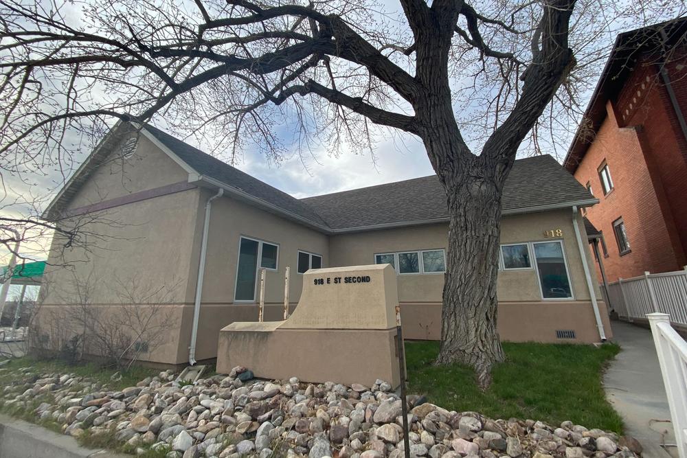 The future site of the Wellspring Wyoming Health Access clinic is a residential-style building sandwiched between a gas station and a small apartment house near downtown Casper, Wyoming.