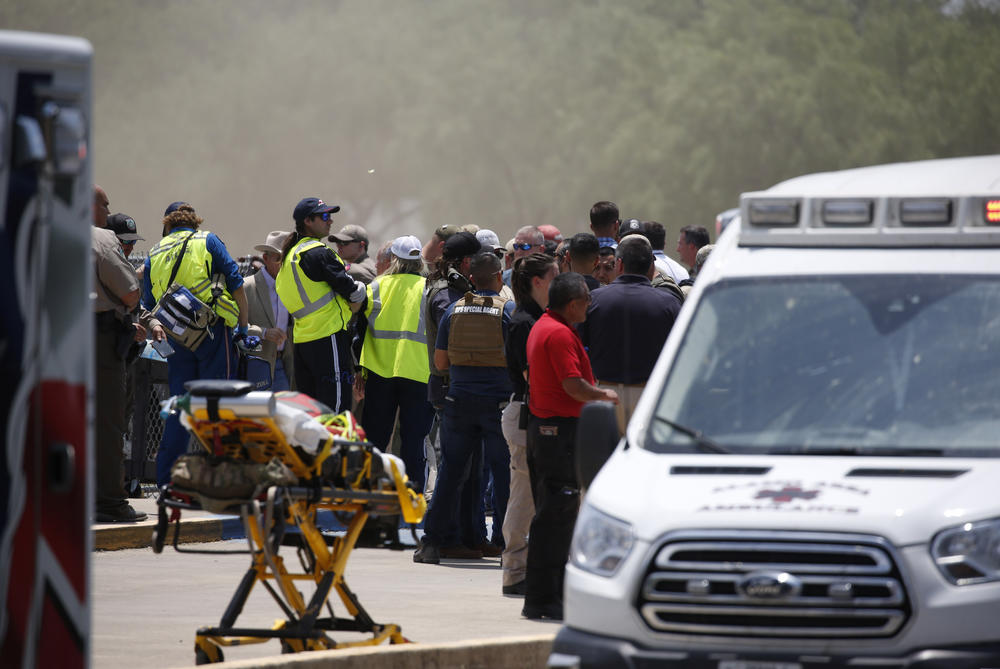 Emergency personnel gather near Robb Elementary School following the shooting.