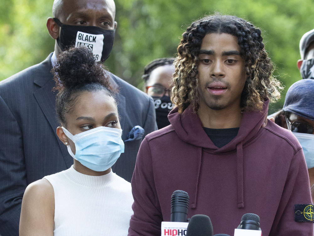 Taniyah Pilgrim and Messiah Young address the press at Morehouse College in Atlanta. Prosecutors filed charges against six officers involved in the couple's arrest.