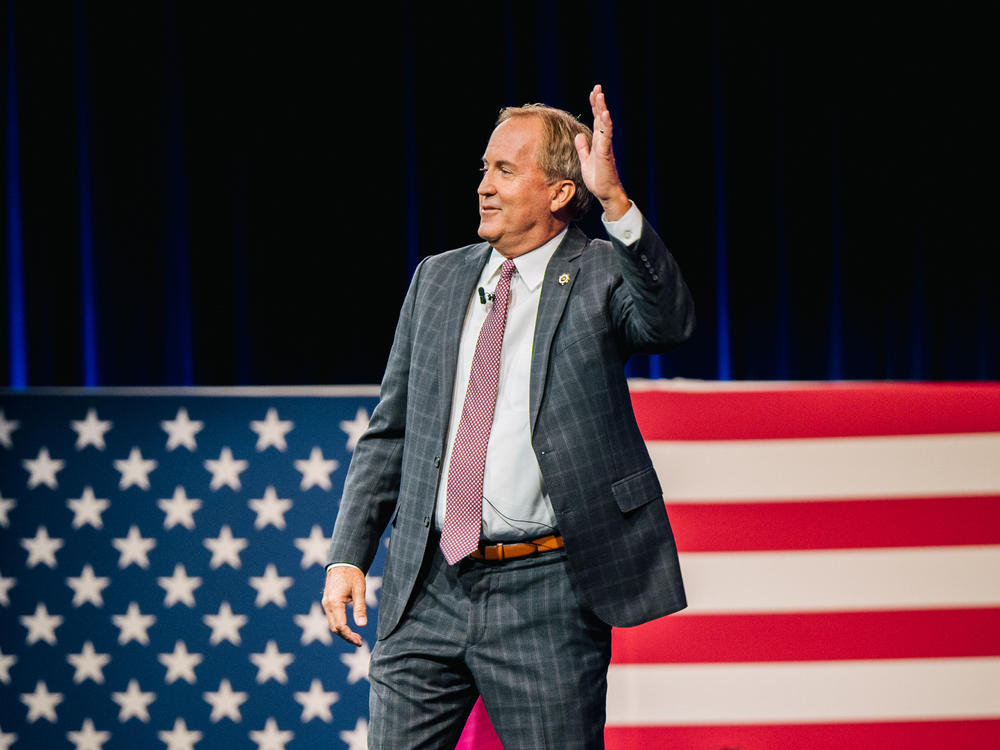 Texas Attorney General Ken Paxton waves after speaking during the Conservative Political Action Conference at the Hilton Anatole in July 2021 in Dallas, Texas. Tuesday, Paxton won the GOP primary for attorney general Tuesday.