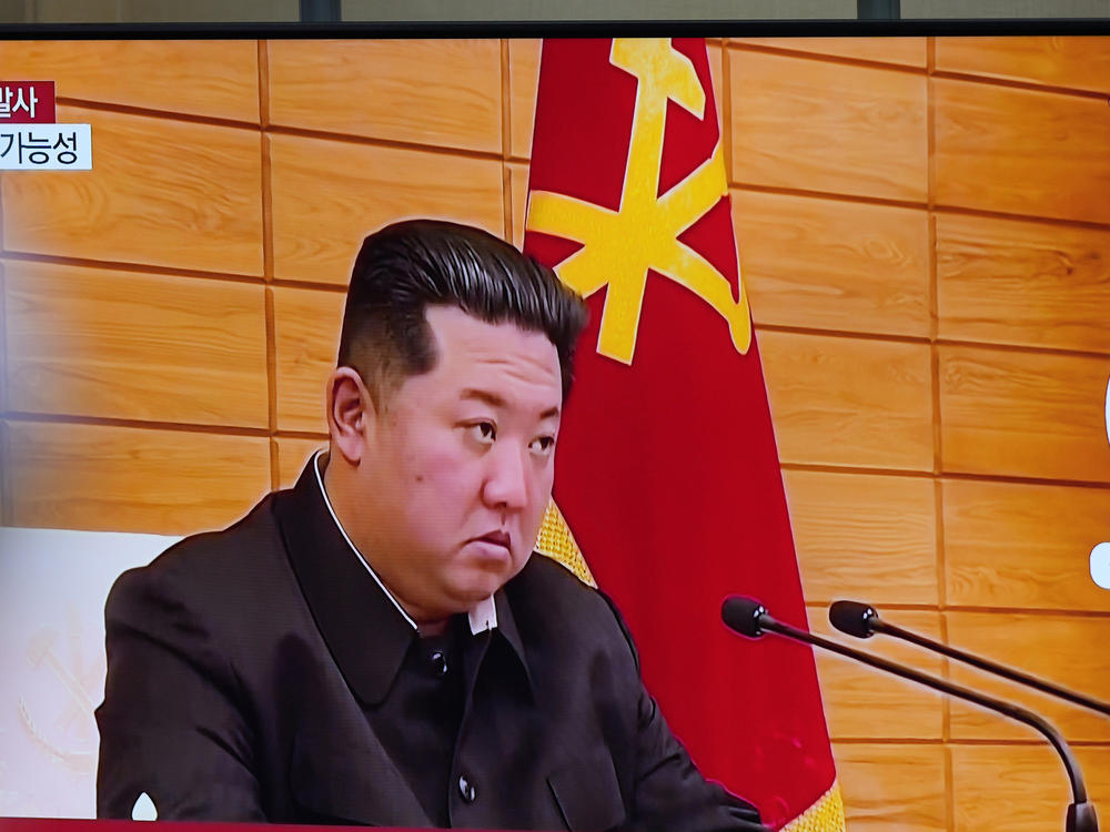 A TV screen shows a news program reporting about North Korea's missile launch with file footage of North Korean leader Kim Jong Un, at a train station in Seoul, South Korea, Wednesday, May 25, 2022.