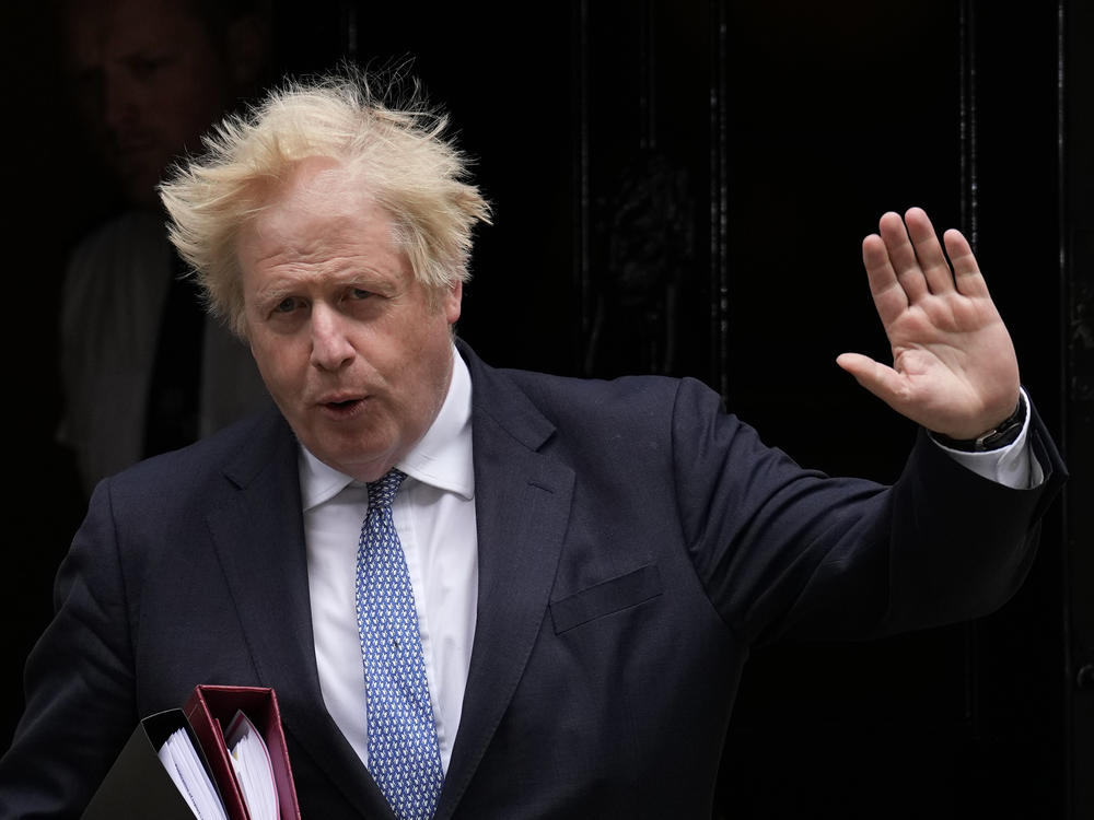 British Prime Minister Boris Johnson leaves 10 Downing Street in London on Wednesday. A report into lockdown-breaching U.K. government parties says blame for a culture of rule-breaking in Johnson's office must rest with those at the top.