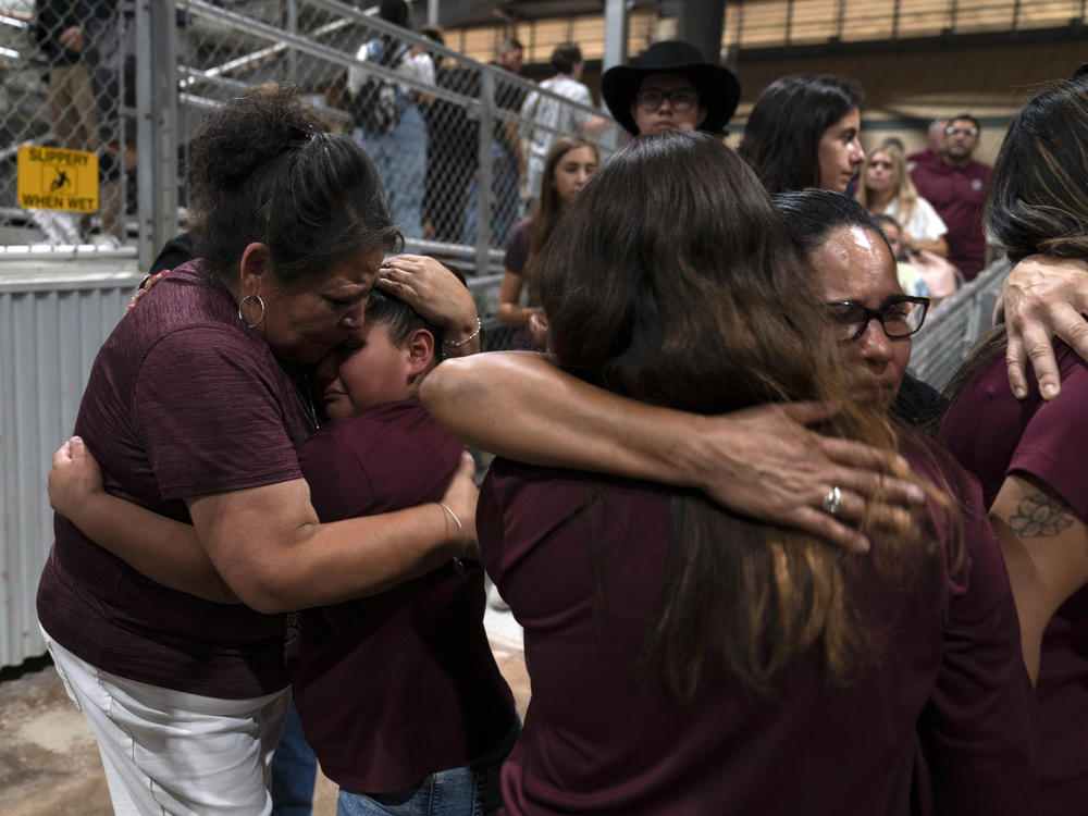 Family members of one of the victims killed in a shooting at Robb Elementary School embrace each other after a prayer vigil in Uvalde, Texas, on Wednesday.