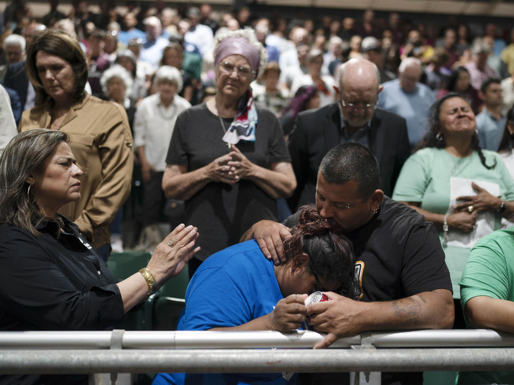 Two family members of one of the victims killed in a shooting at Robb Elementary School comfort each other during a prayer vigil in Uvalde, Texas, on Wednesday.