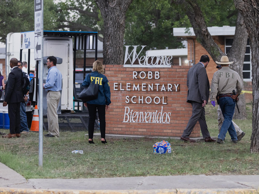 Law enforcement work the scene on Tuesday after a mass shooting at Robb Elementary School in Uvalde, Texas.