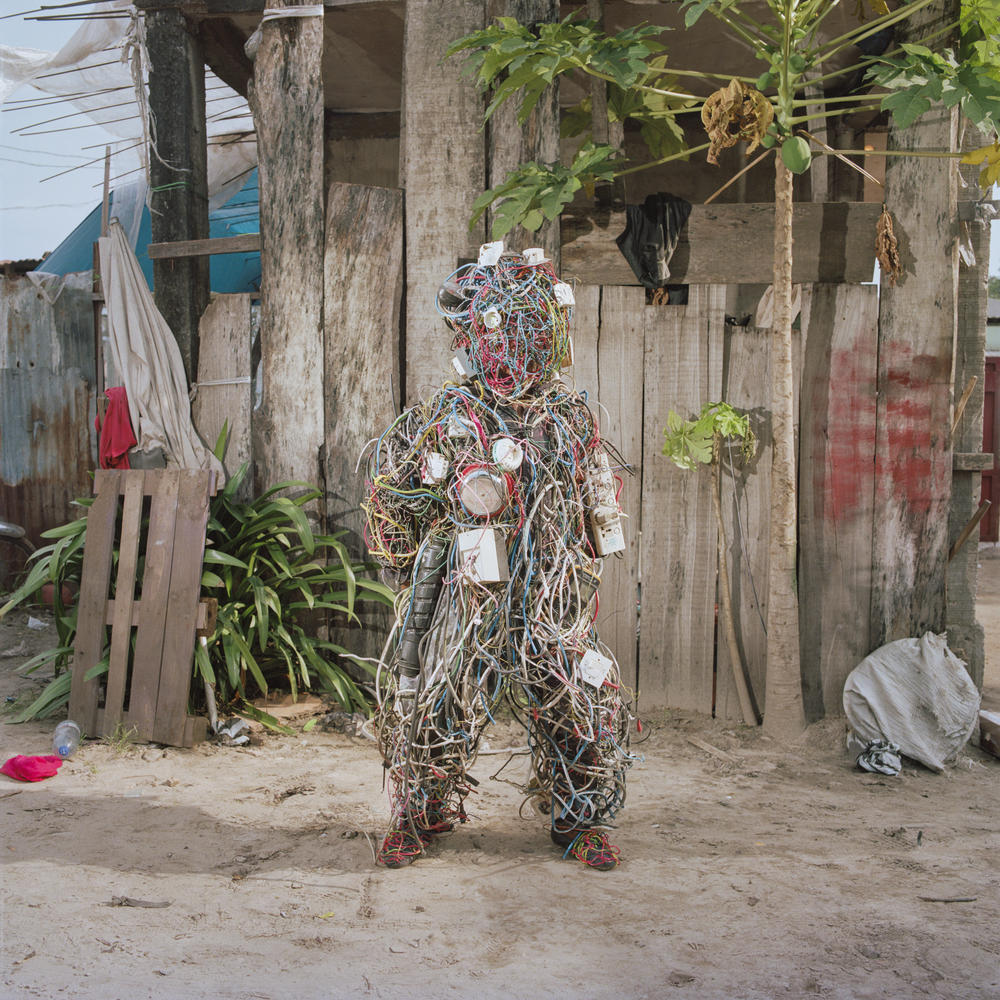 Falonne Mambu models her suit made of electric wires, which represents her country's aspiration to be a major generator of electricity. Although DRC is home to two powerful hydroelectric dams, they operate at minimal capacity — and only 19% of the country's population has access to electricity, according to USAID.