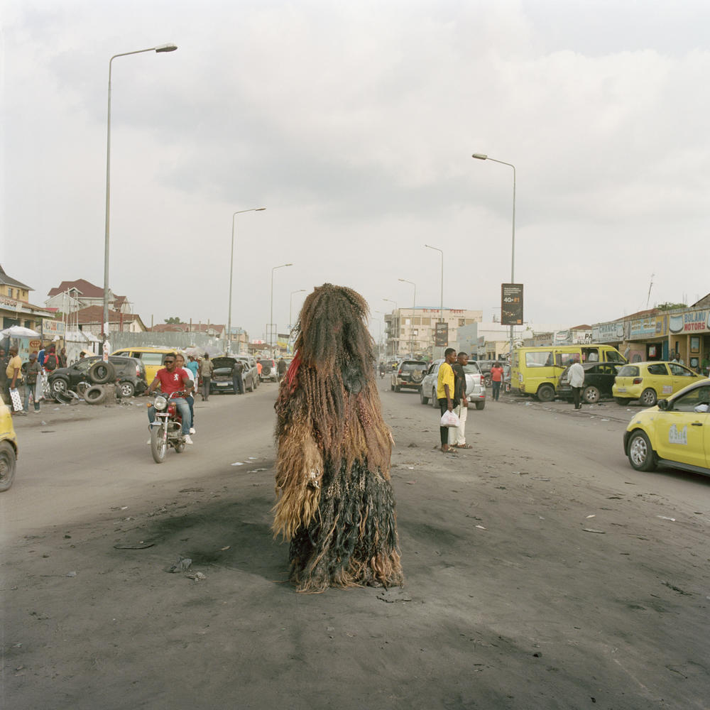 David Baketimina wears the costume he created out of artificial hair. 