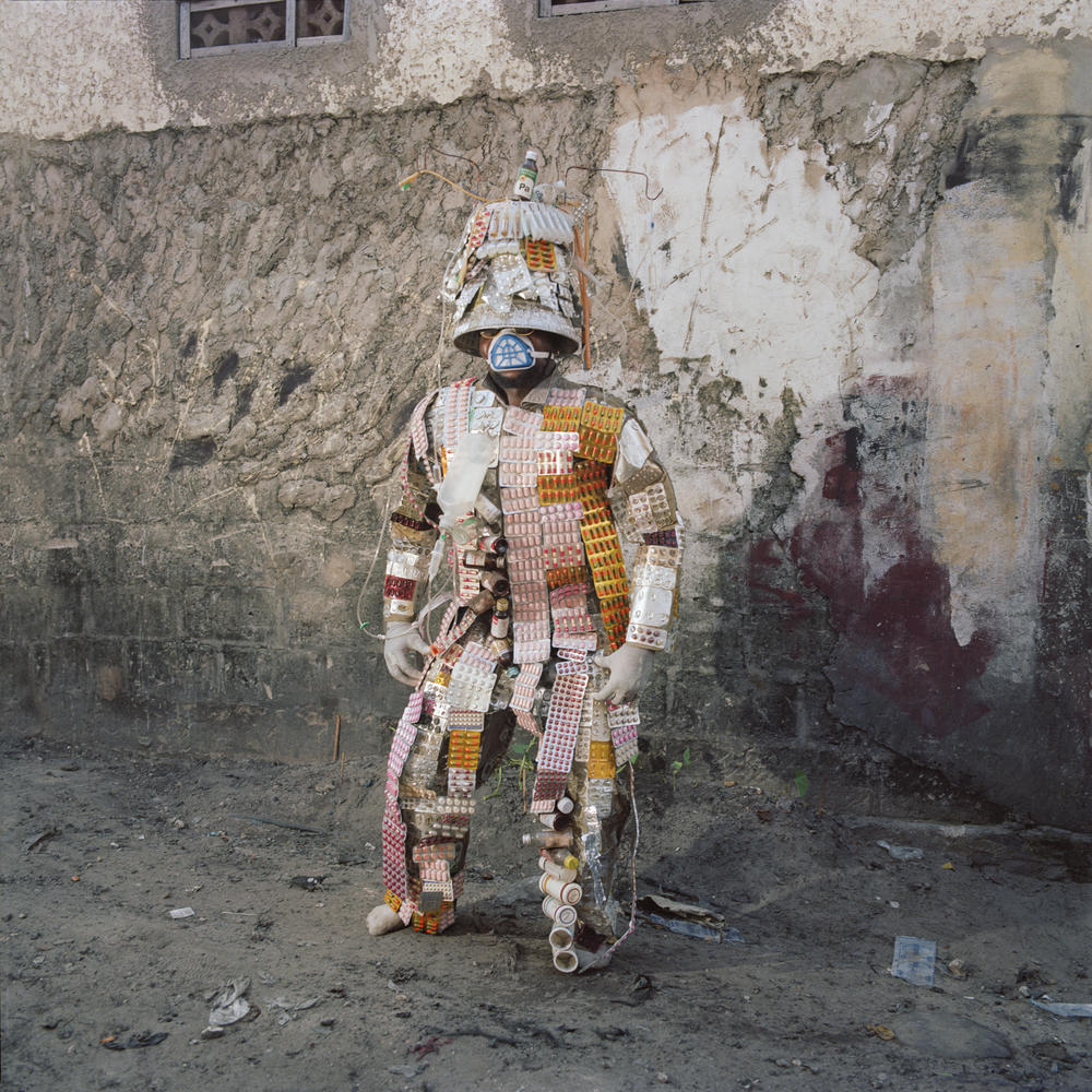 Florian Sinanduku's costume, made of packs of pills, is a statement against counterfeit drugs.