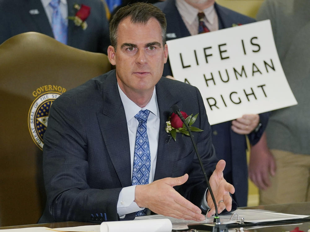 Oklahoma Gov. Kevin Stitt speaks after signing into law a bill making it a felony to perform an abortion, punishable by up to 10 years in prison, on April 12, 2022, in Oklahoma City.